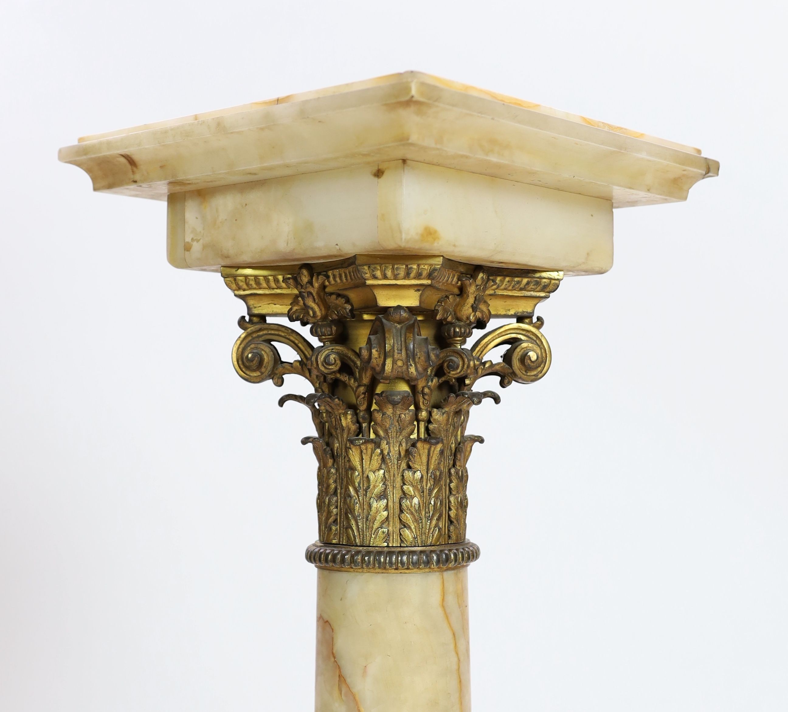 An Edwardian ormolu mounted onyx pedestal, W,32cm H.117cm